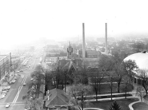 Salt Lake Tribune file photo

Temple Square's Assembly Hall and Tabernacle are seen with smoke stacks looming in the background in this 1956 view of South Temple.