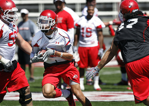 Scott Sommerdorf  |  The Salt Lake Tribune
Utah WR Dres Anderson darts through the defense with a short pass during the second day of pre-season camp for the Utah Utes football team, as they practice on the Rice-Eccles stadium at the University of Utah Friday, August 5, 2011.