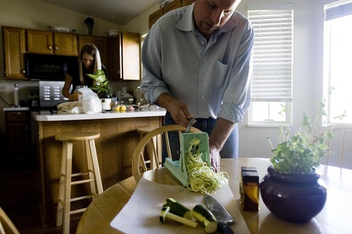 Djamila Grossman  |  The Salt Lake Tribune

Christopher and Megan Stubb make raw zucchini pasta with marinara sauce and coconut cream-filled chocolate patties, at their home in Riverton. Megan has been eating raw for about eight years, Christopher for about five.