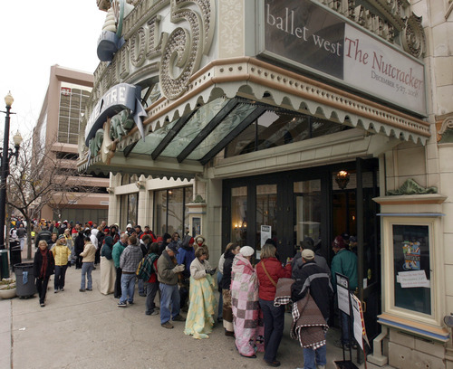 Hundreds wait in line outside the Capitol Theatre in Salt Lake City to buy tickets for the show 