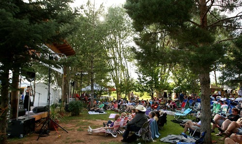 Leah Hogsten  |  The Salt Lake Tribune
Crowd relaxes at the 5th annual Women's Redrock Music Festival Friday in Torrey.