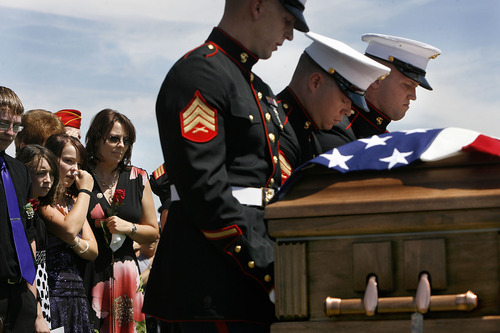 Scott Sommerdorf  |  The Salt Lake Tribune
Family members including Tracy Beede, nearest to the Marines, the mother of Sgt. Daniel Gurr, watch as the Marine honor guard handles the casket. Gurr, 21, was killed by small arms fire while on patrol in the village of Malozai, Afghanistan.