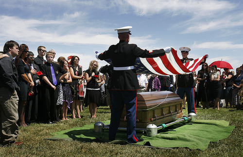 Scott Sommerdorf  |  The Salt Lake Tribune
Family members watch at left as the Marine honor guard handles the flag at the grave of Sgt. Daniel Gurr in Vernal on Saturday. Gurr, 21, was killed by small arms fire while on patrol in the village of Malozai, Afghanistan.