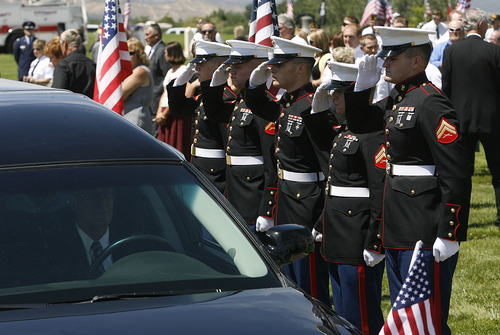 Scott Sommerdorf  |  The Salt Lake Tribune
A Marine honor guard alutes as the hearse containing the casket of Sgt. Daniel Gurr arrives at the Vernal Cemetery on Saturday. Gurr, 21, was killed by small arms fire while on patrol in the village of Malozai, Afghanistan.