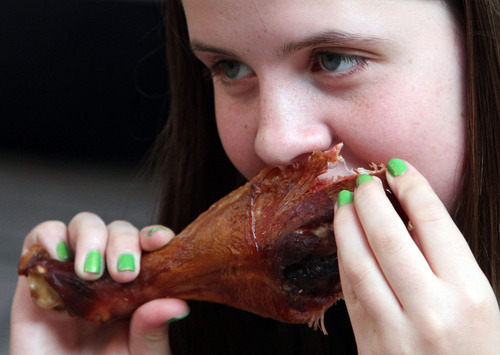 Rick Egan   |  The Salt Lake Tribune

Celeste Russel, 13, eats a smoked turkey leg,at the Utah Shakespeare Festival, Thursday, July 7, 2011.