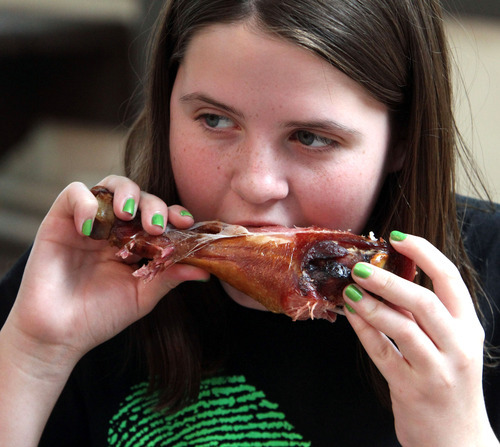 Rick Egan   |  The Salt Lake Tribune

Celeste Russel, 13, eats a smoked turkey leg at the Utah Shakespeare Festival, Thursday, July 7, 2011.