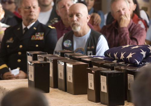 Al Hartmann  |  The Salt Lake Tribune
The Missing in America Project conducted its first mission in the State of Utah by honoring fifteen veterans whose remains have been in the care of Deseret Mortuary in Salt Lake City, UT, yet remained unclaimed.   Representatives from branches of the armed forces, Patriot Guard Riders, POW/MIA Riders and Green Knights conducted a ceremony to honor the forgotten remains before burial at Veterans Memorial Park.   Fourteen boxes with creamated remains and 14 American flags are front and center during  the ceremony.