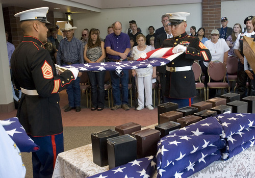 Al Hartmann  |  The Salt Lake Tribune
The Missing in America Project conducted its first mission in the State of Utah by honoring fifteen veterans whose remains have been in the care of Deseret Mortuary in Salt Lake City, UT, yet remained unclaimed.   
Marine honor guard folds flag in ceremony to honor Marine Corp members among the unclaimed remains during ceremony at Veterans Memorial Park.