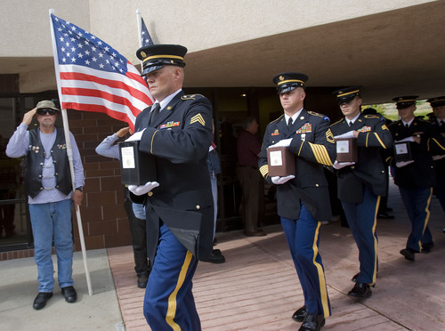 Al Hartmann  |  The Salt Lake Tribune
The Missing in America Project conducted its first mission in the State of Utah by honoring fifteen veterans whose remains have been in the care of Deseret Mortuary in Salt Lake City, UT, yet remained unclaimed.   Representatives from branches of the armed forces take cremated remains from hearse to a ceremony and eventual burial at Veterans Memorial Park.