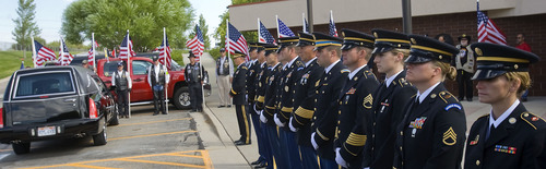 Al Hartmann  |  The Salt Lake Tribune
The Missing in America Project conducted its first mission in the State of Utah by honoring fifteen veterans whose remains have been in the care of Deseret Mortuary in Salt Lake City, UT, yet remained unclaimed.   Representatives from branches of the military stand at attention before taking cremated remains from hearse to a ceremony and eventual burial at Veterans Memorial Park.