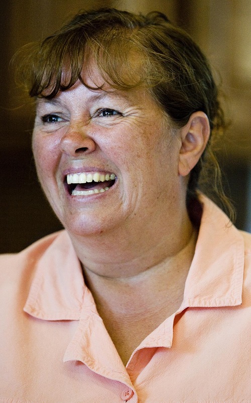 Djamila Grossman  |  The Salt Lake Tribune
Debbie Beauregard laughs as she watches her guests from Bulgaria dig into the buffet at her family's Bountiful home on Aug. 7. This is the second year the Beauregards have been hosts for foreign visitors, including 12 people from Bulgaria this year.