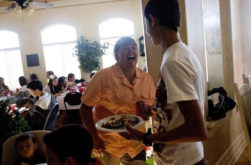 Djamila Grossman  |  The Salt Lake Tribune
Debbie Beauregard shares a laugh with Martin Kolev from Bulgaria at her family's Bountiful home on Aug. 7. This is the second year the Beauregards have been hosts for foreign visitors, including 12 people from Bulgaria this year.