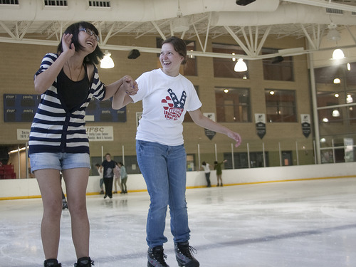 Margaret Distler  |  The Salt Lake Tribune 
Rose Lee laughs as she learns ice skating tips from Anna Peterson of North Salt Lake at the South Davis Recreation Center recently.