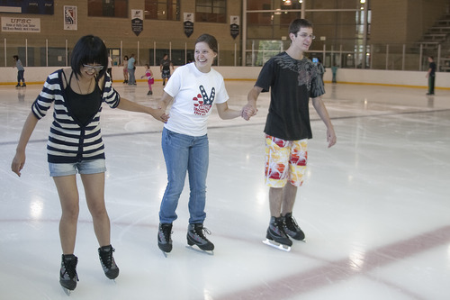 Margaret Distler  |  The Salt Lake Tribune 
Rose Lee learns ice skating tips from Anna Peterson of North Salt Lake and Marcelo Leszynski of Bountiful at the South Davis Recreation Center recently.