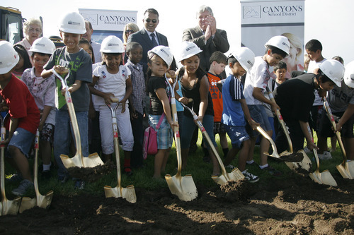 Margaret Distler  |  The Salt Lake Tribune 

Midvale Elementary School students help turn the dirt at the groundbreaking at the site of their new school at 7852 S. Pioneer Street recently.