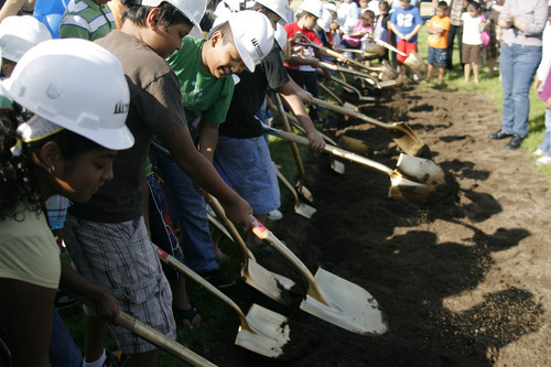 Margaret Distler  |  The Salt Lake Tribune 

Midvale Elementary School students help turn the dirt at the groundbreaking at the site of their new school at 7852 S. Pioneer Street on Aug. 3. The new 85,000 square foot school building is scheduled to open in fall 2012.