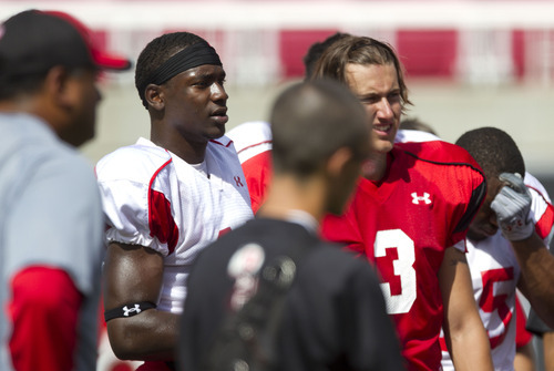 Lennie Mahler  |  The Salt Lake Tribune
DeVonte Christopher and Jordan Wynn listen to coach Kyle Whittingham's closing remarks after practice Monday, Aug. 15, 2011, at Rice-Eccles Stadium.