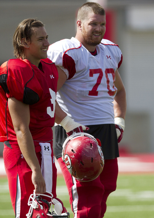 Lennie Mahler  |  The Salt Lake Tribune
Jordan Wynn and Tony Bergstrom talk on the sideline during Utah football practice Monday, Aug. 15, 2011, at Rice-Eccles Stadium.