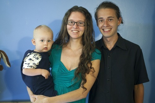 Chris Detrick  |  The Salt Lake Tribune
Dave and Angelina Love and their son Moonee, 19 months, pose for a portrait in their apartment at the University of Utah on Thursday, August 18, 2011. Angelina Love calls for the expansion of breast-feeding laws in Utah and beyond.