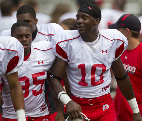 Lennie Mahler  |  The Salt Lake Tribune
DeVonte Christopher, right, and Charles Henderson joke as they leave the field after football practice Monday, Aug. 15, 2011, at Rice-Eccles Stadium.