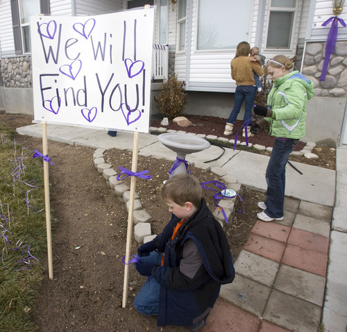 Al Hartmann  |  The Salt Lake Tribune  1/26/2110
Friends and family of Susan Powell put purple ribbons around her home and signs saying that she is loved, missed and that she will be found.