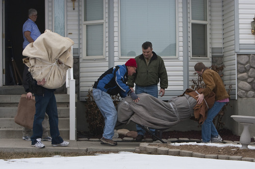 Photo by Chris Detrick  |  The Salt Lake Tribune 
Friends help Josh Powell move his belongings out of his home in West Valley City into a Uhaul truck Saturday January 9, 2010.   About ten people including friends, family members, and neighbors of Joshua Powell arrived at his West Valley City home Saturday morning to help him pack a moving truck headed for Washington.

Several people who began putting boxes into the truck shortly after 9 a.m. said they wanted to help Joshua Powell despite questions surrounding the disappearance of his wife, Susan, just over one month ago. Joshua Powell is the only person of interest investigators have identified in his wife's case so far, and police have criticized him for not being more cooperative with their investigation.