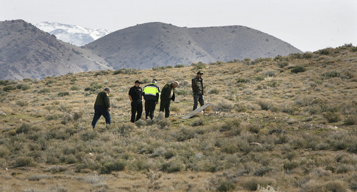 Scott Sommerdorf  |  Salt Lake Tribune
SUSAN POWELL SEARCH
Searchers stop to examine some rubble as they scour the areas in and around Simpson Springs Saturday, 4/10/10.