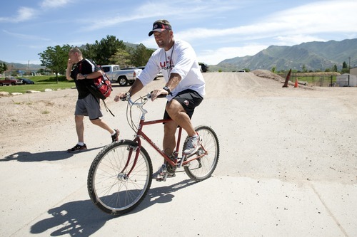 Chris Detrick  |  The Salt Lake Tribune
Utah Ute coach Kyle Whittingham after rides his 1981 Diamond Back mountain bike after practice at the University of Utah on Thursday, Aug. 18, 2011.