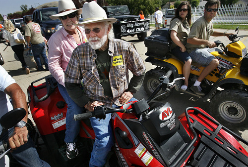 Scott Sommerdorf  |  The Salt Lake Tribune
Retired Kane County Commissioner Mark Habbeshaw mounts up on an ATV for the ride to the Capitol building with other Open Roads advocates. Open Roads activists rallied at the State Fairpark for speeches, and then drove to the state Capitol on Saturday.