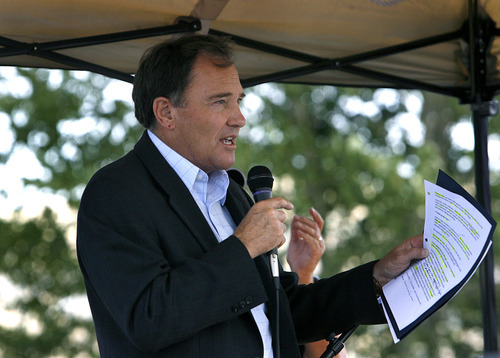 Scott Sommerdorf  |  The Salt Lake Tribune
Utah Gov. Gary Herbert speaks to supporters of the Open Roads issue at the state Fairpark. Open roads activists rallied at the State Fairpark for speeches, and then drove to the Capitol.