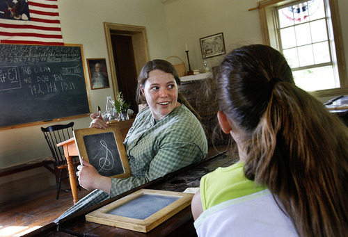 Scott Sommerdorf  |  The Salt Lake Tribune
Sarah Durtschi teaches young visitors the Deseret Alphabet at the schoolhouse at This is The Place Heritage Park in Salt Lake City, Thursday July 29, 2011.
