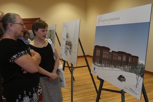 Rick Egan   |  The Salt Lake Tribune

L-R  Carol Hintze and Lorianne Bisping discuss a proposal for the Village Center at an open house at Holladay City Hall, Wednesday, August 17, 2011.  Holladay held the open house for the public to ask questions about a proposed alternative to a previously approved plan.