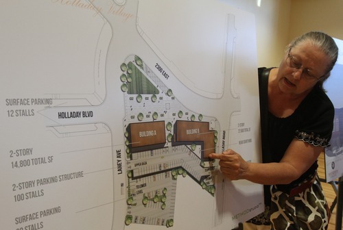 Rick Egan   |  The Salt Lake Tribune

Carol Hintze checks out the renderings of a proposed design for the Holladay Village Center that would feature ground-level shops topped by offices, Wednesday, August 17, 2011.