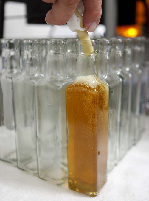 Trent Nelson  |  The Salt Lake Tribune
Bottles are filled with honey vinegar at the Slide Ridge farm in Mendon.