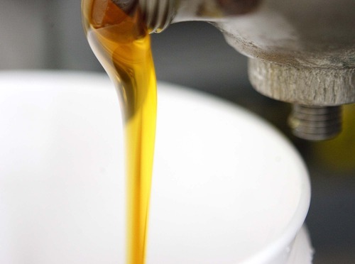 Trent Nelson  |  The Salt Lake Tribune
Honey is poured into a bucket at the Slide Ridge farm in Mendon, Utah. Martin James and his family produce a unique Honey Wine Vinegar made from raw honey (from their own hives) and fermented in special process. Similar to balsamic vinegar it can be used as a glaze for meat or drizzled on everything from a salad to ice cream. The honey wine vinegar is getting lots of praise from local experts, who say it's one of the best food products being made in Utah.
Tuesday, August 16, 2011.