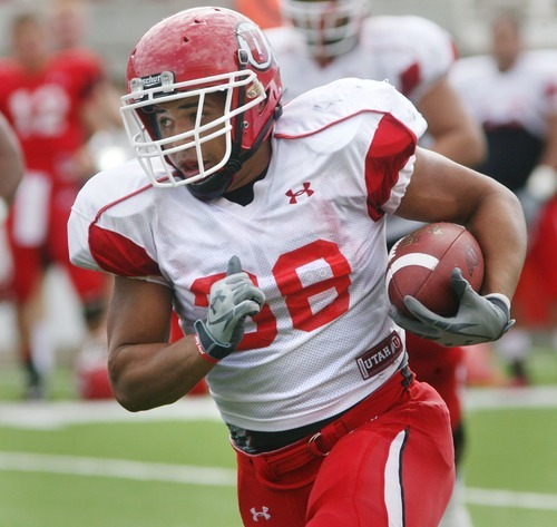 Steve Griffin  |  The Salt Lake Tribune

University of Utah fullback, Karl Williams, charges up field during University of Utah football practice at Rice Eccles Stadium on the university campus in Ogden, Utah Friday, August 19, 2011.