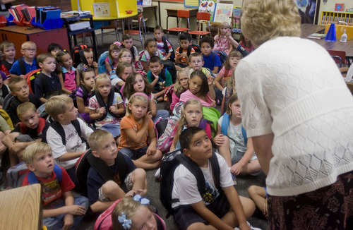 Al Hartmann  |  The Salt Lake Tribune
First-graders at Horizon Elementary School in Murray listen intently to Linda Curtis, their English speaking teacher on the first day of school Monday August 22.  The class is dual immersion.     They spend the other half of their classroom experience with their Spanish speaking teacher Karina Guzman.