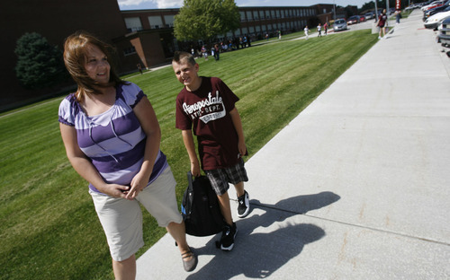 Francisco Kjolseth  |  The Salt Lake Tribune
Sharon Vinson of Sandy hears about her son's day as she picks up Zach, 12, following his first day of 7th grade at Midvale Middle school  on Monday, August 22, 2011. Middle school is a transition time for seventh-graders and their parents as students are grappling with new academic and social challenges and parents are watching their kids become increasingly independent.