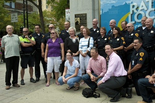 Chris Detrick  |  The Salt Lake Tribune
Members of Salt Lake City Police and descendants of Andrew Burt pose for a portrait in front of a new plaque memorializing Chief Andrew Burt for the ultimate sacrifice he made while protecting the community 128 years ago. The ceremony took place outside the Walker Center on Main Street in Salt Lake City on Thursday, Aug. 25, 2011.