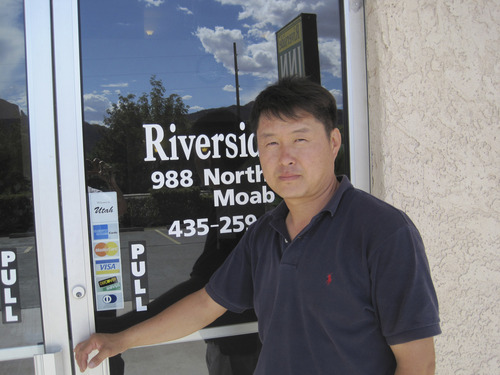Lisa J. Church  |  Special for The Salt Lake Tribune

Moab motel owner Jung Park poses outside the Riverside Inn. Park confirmed that bones found off Interstate 70 this spring are likely those of his father, Hae C. Park, who is believed to have been murdered in 2010.
