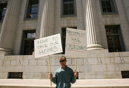 Trent Nelson  |  The Salt Lake Tribune

Jacob Thomas was part of a rally held in front of the federal court house Thursday in Salt Lake City to call attention to foreclosures in advance of a hearing over whether to dismiss a proposed class action lawsuit. The homeowners believe ReconTrust, the foreclosure arm of Bank of America, has been foreclosing on them illegally.