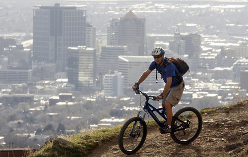 Tribune file photo
A rider takes to the Bonneville Shoreline Trail in the foothills above the University of Utah.