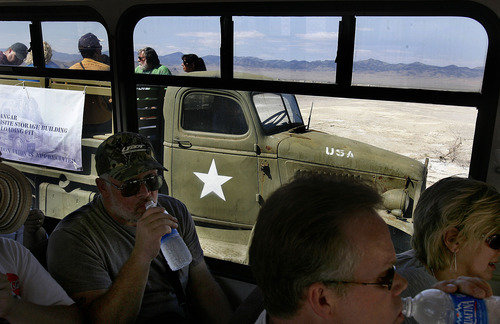 Scott Sommerdorf  |  The Salt Lake Tribune
People were taken on a tour of the secret Wendover Airfield World War II base facilities in vintage WW II vehicles. The tour opened up areas which have never been seen before. The tour included rarely open buildings and areas such as: Atomic bomb loading pit Atomic bomb assembly buildings Bomb Storage Bunkers Enlisted Mess hall Aircraft hangars Fire station Enlisted Barracks Norden Bombsight building Officers Mess hall B-29 Enola Gay hangar, Saturday, August 26, 2011.