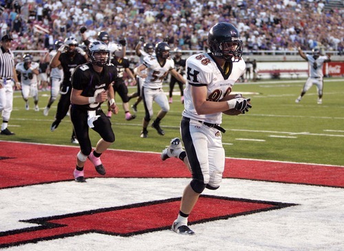 Trent Nelson  |  The Salt Lake Tribune
Herriman's David Christensen pulls in the game-winning pass on a two-point conversion. Herriman vs. Riverton High School football at Rice-Eccles Stadium in Salt Lake City, Utah, Saturday, August 27, 2011.