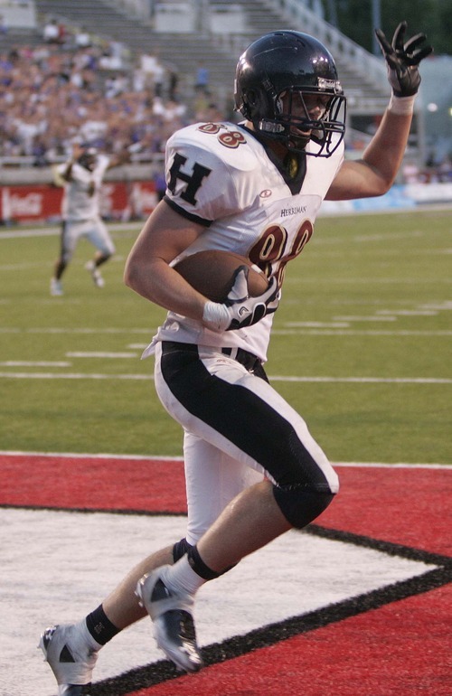 Trent Nelson  |  The Salt Lake Tribune
Herriman's David Christensen pulls in the game-winning pass on a two-point conversion. Herriman vs. Riverton High School football at Rice-Eccles Stadium in Salt Lake City, Utah, Saturday, August 27, 2011.