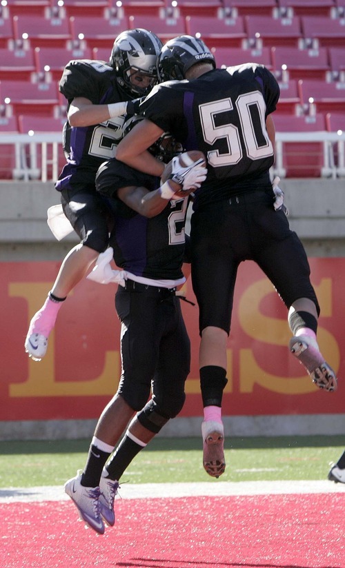 Trent Nelson  |  The Salt Lake Tribune
Riverton's Stratton Brown, center, and teammates celebrate after he scored a touchdown in the first half. Herriman vs. Riverton High School football at Rice-Eccles Stadium in Salt Lake City, Utah, Saturday, August 27, 2011.