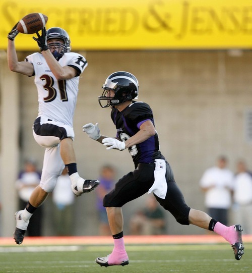 Trent Nelson  |  The Salt Lake Tribune
Herriman's Trevor Harwood pulls in a pass, with Riverton's Taylor Stirland defending. Herriman vs. Riverton High School football at Rice-Eccles Stadium in Salt Lake City, Utah, Saturday, August 27, 2011.