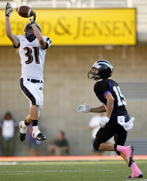 Trent Nelson  |  The Salt Lake Tribune
Herriman's Trevor Harwood pulls in a pass, with Riverton's Taylor Stirland defending. Herriman vs. Riverton High School football at Rice-Eccles Stadium in Salt Lake City, Utah, Saturday, August 27, 2011.