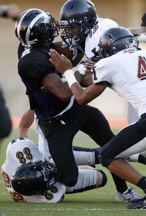 Trent Nelson  |  The Salt Lake Tribune
Riverton's Stratton Brown, left, is brought down by Herriman's Francis Bernard. Herriman vs. Riverton High School football at Rice-Eccles Stadium in Salt Lake City, Utah, Saturday, August 27, 2011.