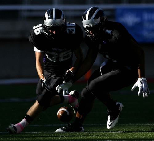 Trent Nelson  |  The Salt Lake Tribune
Riverton's Joey Jensen, left, and Tupou Tua'one Aagard chase down a fumble by Herriman's Tueni Lupeamanu. Herriman vs. Riverton High School football at Rice-Eccles Stadium in Salt Lake City, Utah, Saturday, August 27, 2011.